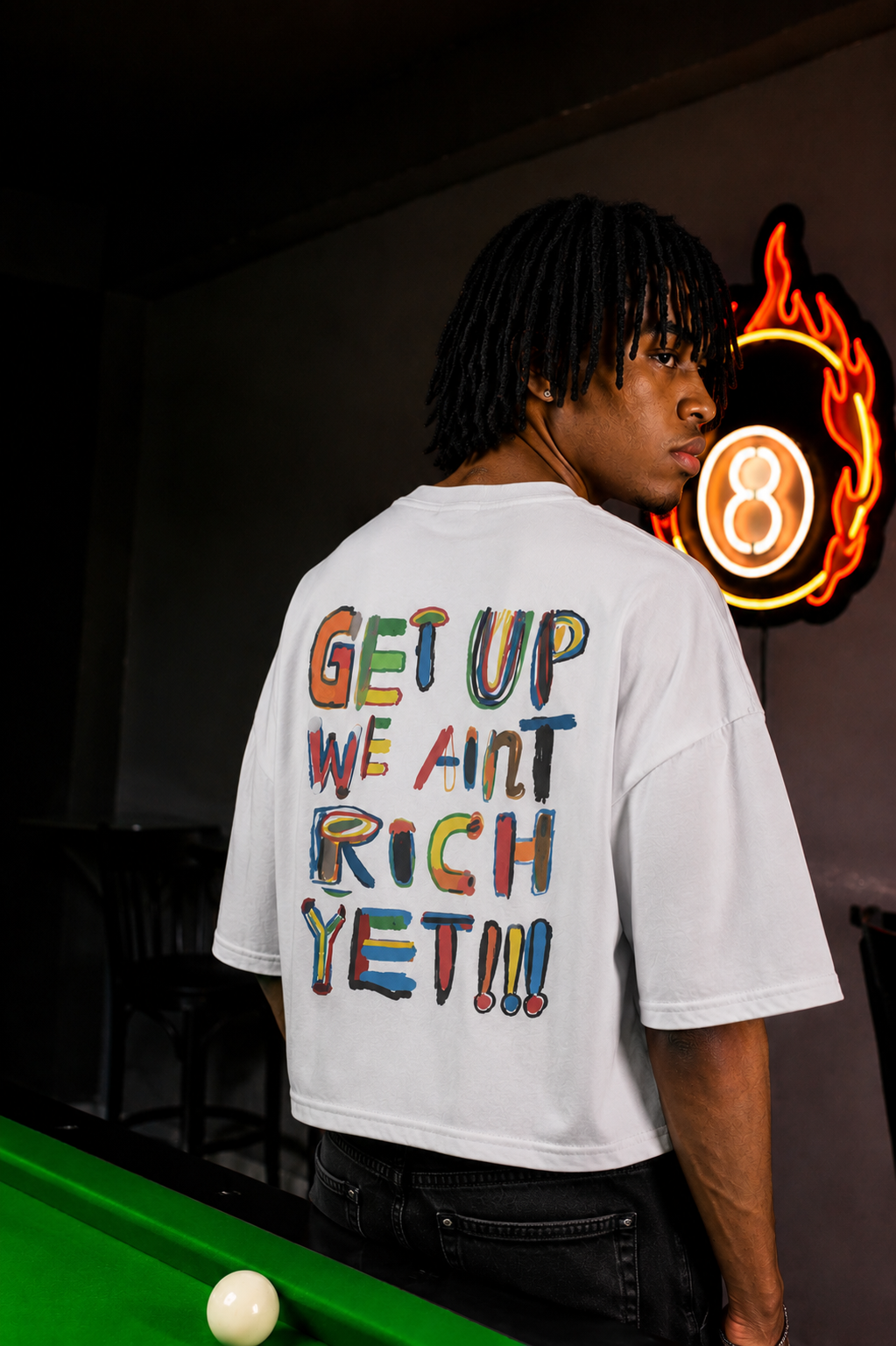 'We Ain’t Rich Yet” Statement Tee