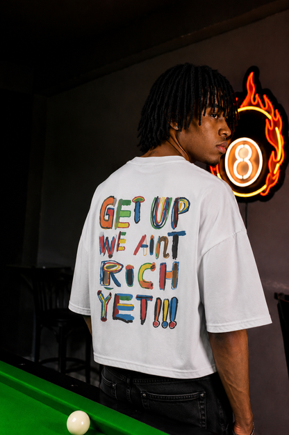 'We Ain’t Rich Yet” Statement Tee