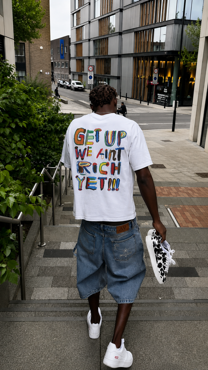 'We Ain’t Rich Yet” Statement Tee